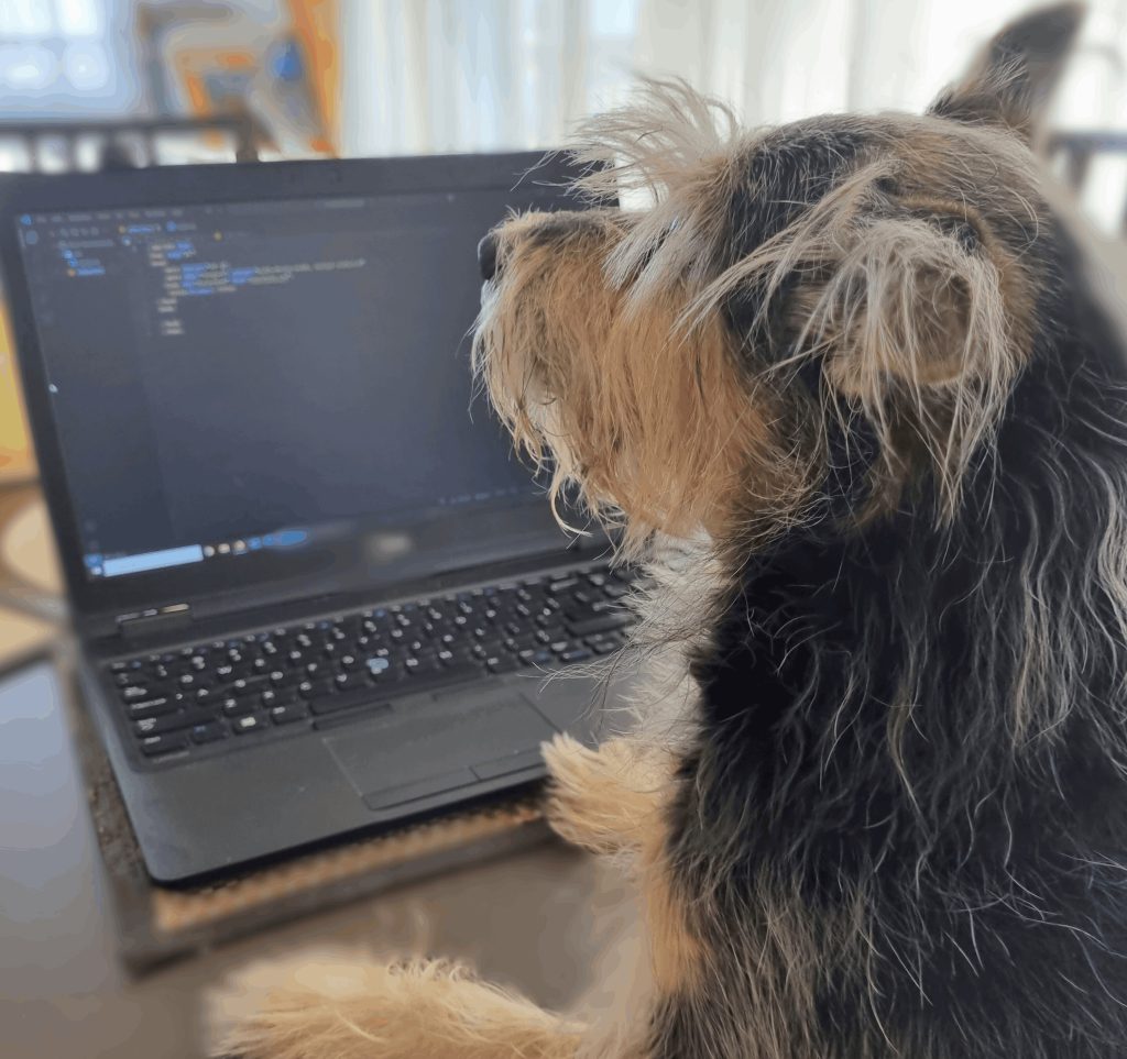 Pies przy laptopie Zabawna ilustracja psa pracującego przy laptopie – symbol kreatywnej pracy online.